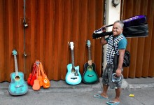 Guitar seller, streets of Manila, PHILIPPINES – photo by Renata Blonska
